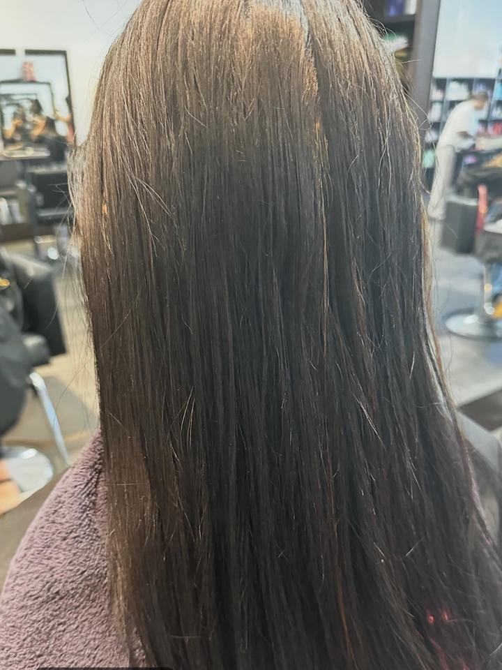 Hair before a vivid magenta color, seen from behind