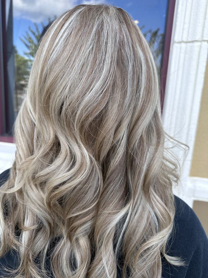 Soft blonde waves, seen from behind