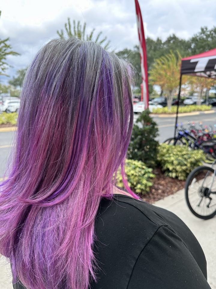 Long layered hair in purple and pink color, seen from behind